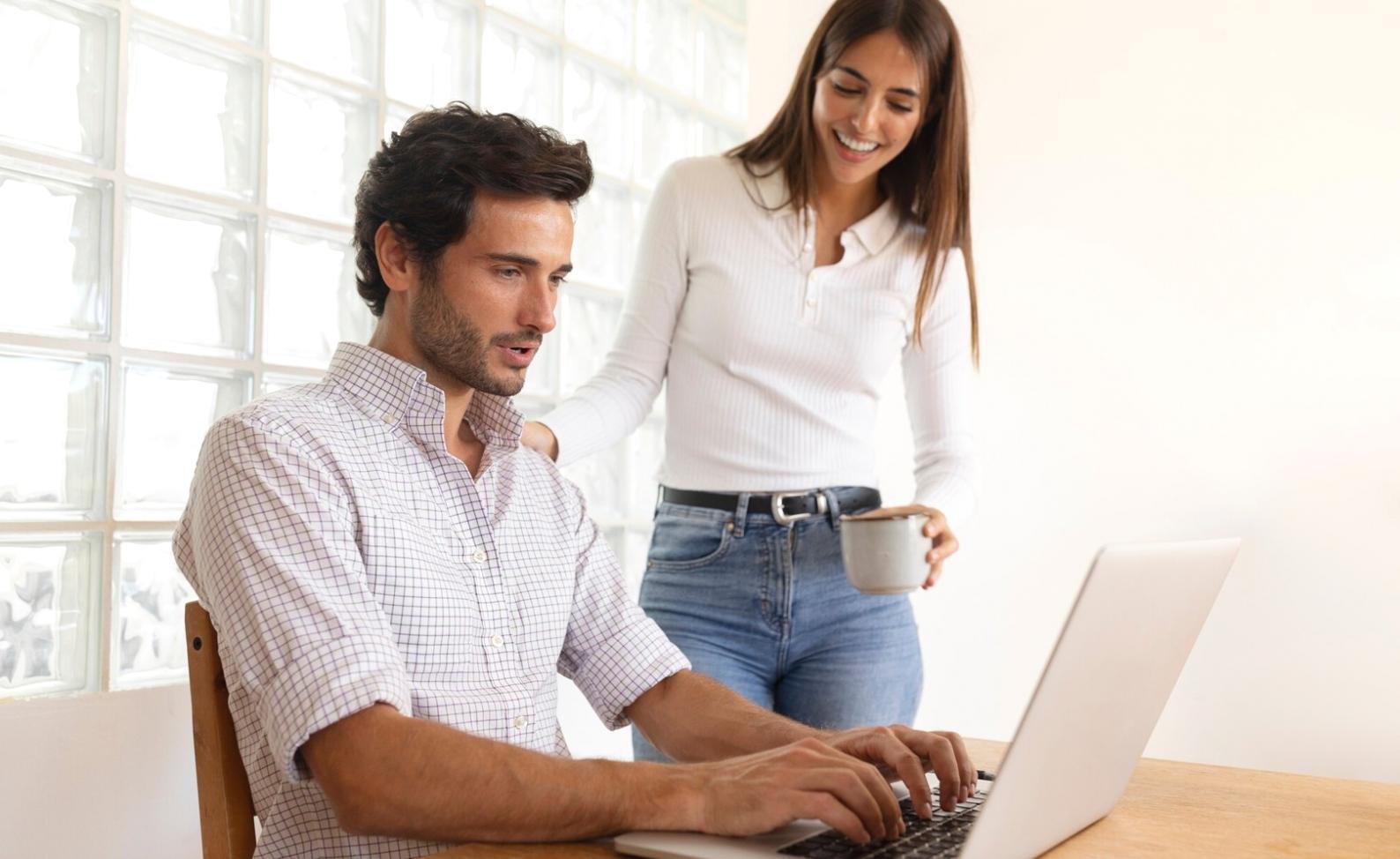 Business professionals analyzing financial data and charts in modern office environment
